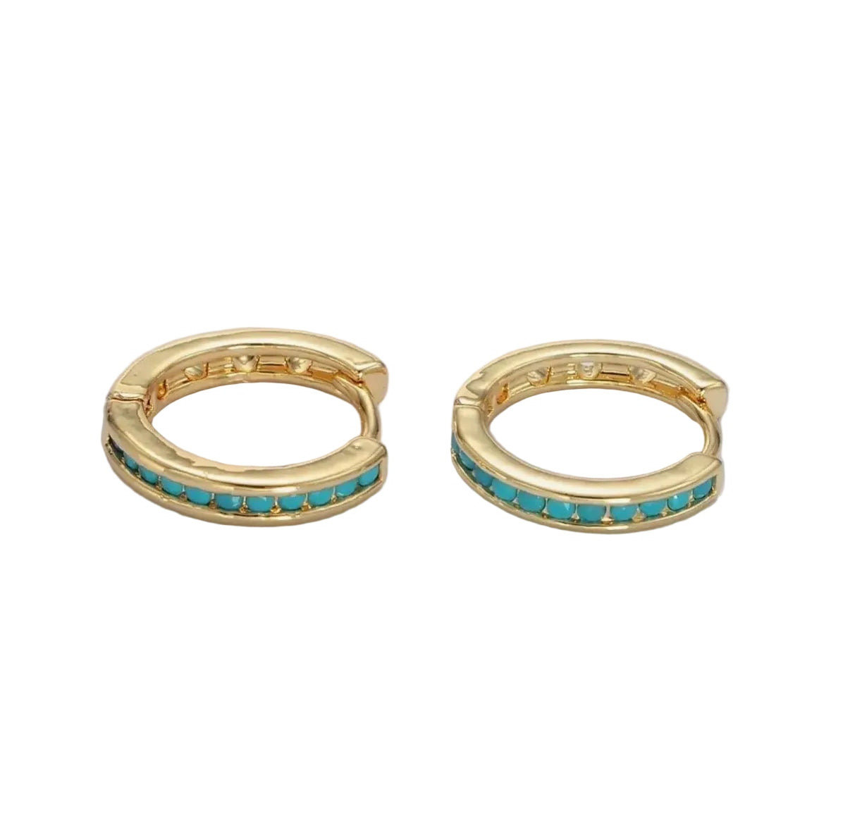 Gold hoop earrings with turquoise stones on a light blue background